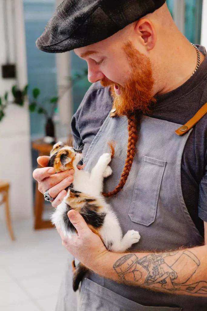 man holding cat